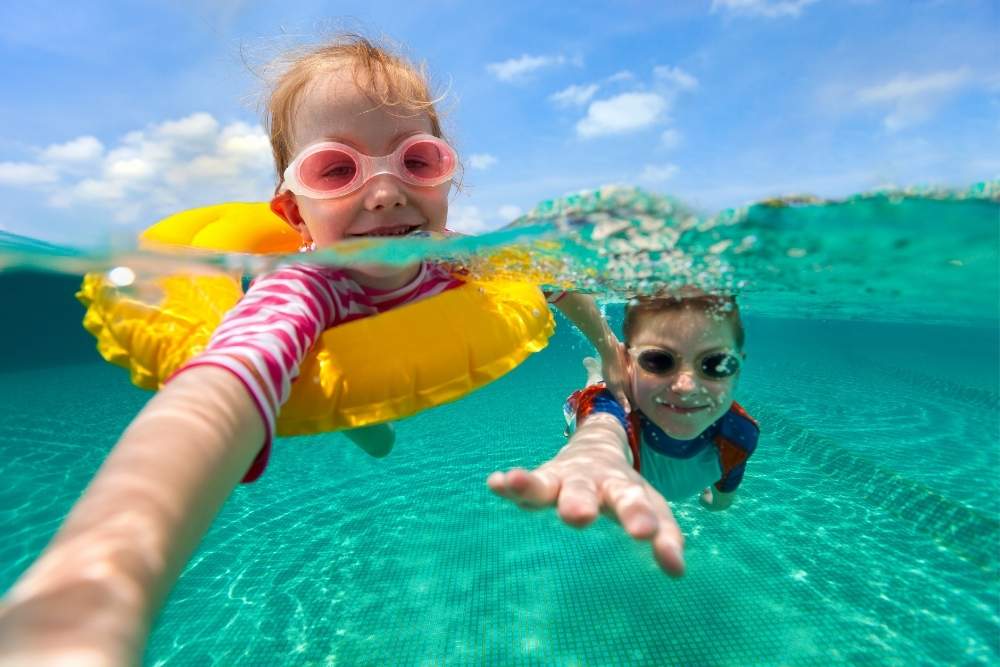 kids swimming in a pool